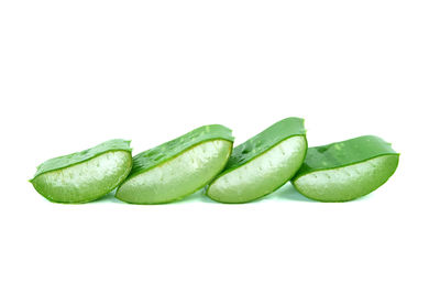 Close-up of green pepper against white background