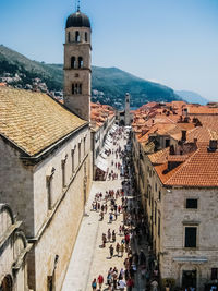 High angle view of buildings in town against sky