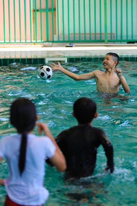 People playing in swimming pool