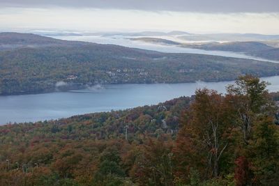 Scenic view of mountains and lake against sky