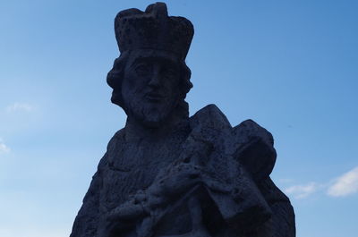Low angle view of statue against sky
