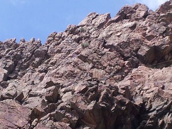 Low angle view of rock formation against clear sky