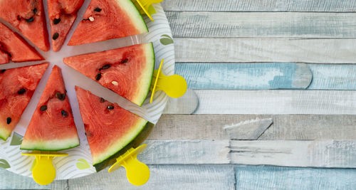 High angle view of fruits in plate on table