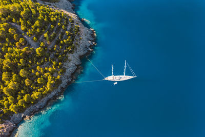 High angle view of sailboat sailing in sea