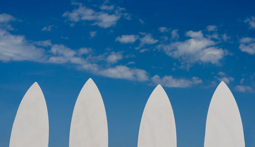 Low angle view of white building against blue sky