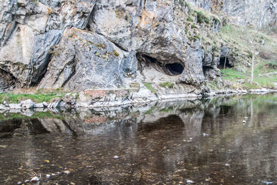 Reflection of rocks in lake