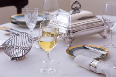 Close-up of wine glasses on table
