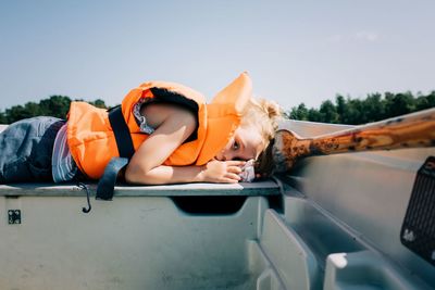 Young girl sleeping on a boat in sweden in summer