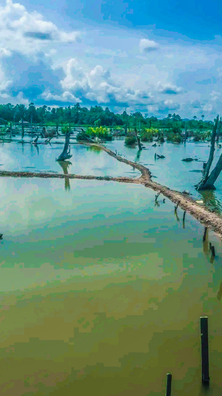 water, sea, nature, sky, shore, beauty in nature, reflection, cloud, scenics - nature, day, tranquility, bay, coast, ocean, no people, outdoors, tranquil scene, land, environment, architecture, horizon, transportation, tree, plant, green, travel, nautical vessel, beach, travel destinations, landscape, blue