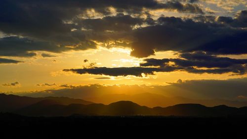 Scenic view of mountains at sunset