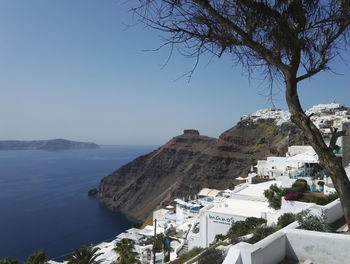 Scenic view of buildings and mountains against clear sky