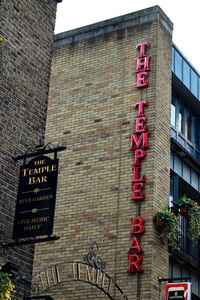 Low angle view of information sign on building