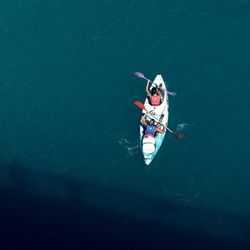 High angle view of people on boat in water