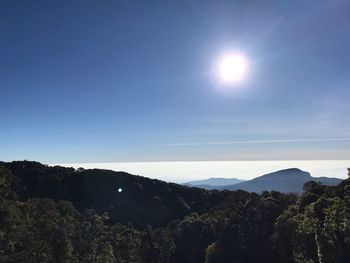 Scenic view of mountains against clear blue sky