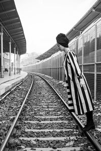 Mannequin wearing casuals on railroad tracks