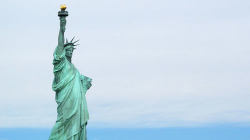 Low angle view of statue against sky