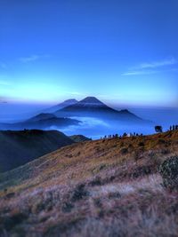 Scenic view of landscape against blue sky