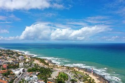 Panoramic view of sea and buildings against sky