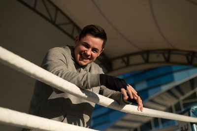 Portrait of young man standing outdoors