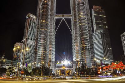 Low angle view of illuminated city at night