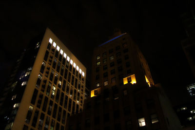 Low angle view of modern building at night