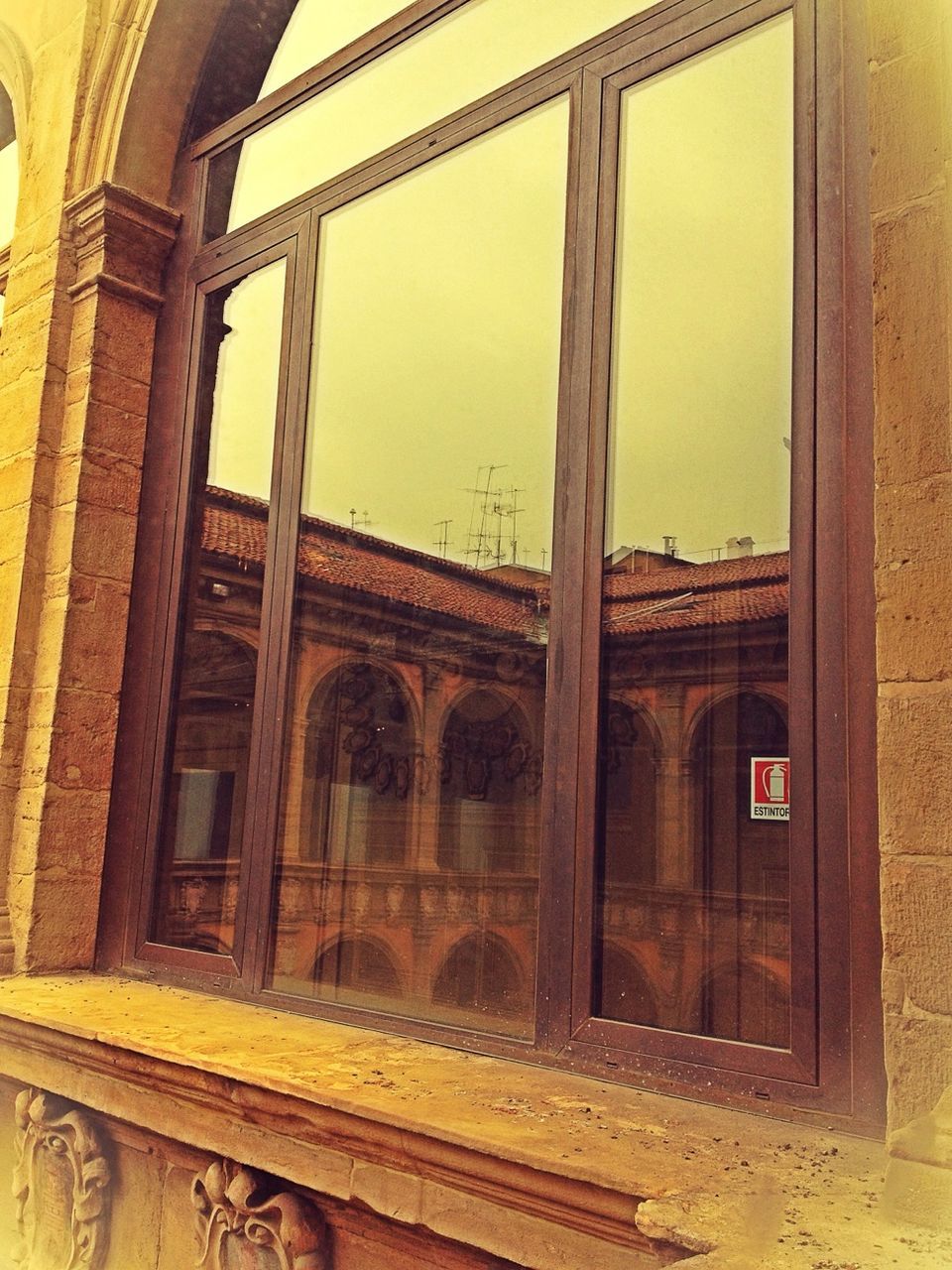 architecture, built structure, window, building exterior, building, arch, indoors, sky, low angle view, old, glass - material, house, abandoned, residential building, residential structure, no people, sunset, exterior, architectural column, day