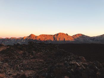 Scenic view of mountain against sky during sunset