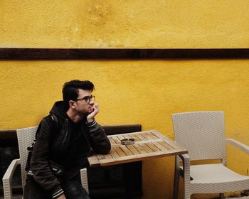 Thoughtful man siting at table