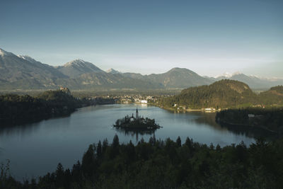 Scenic view of lake and mountains against sky