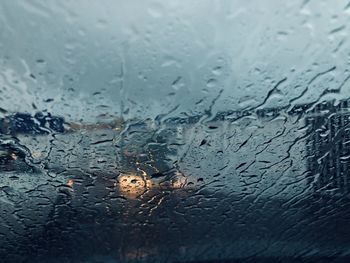 Full frame shot of wet glass window in rainy season