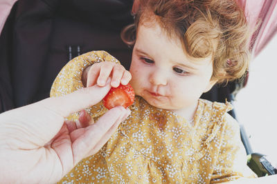 Close-up portrait of boy eating food