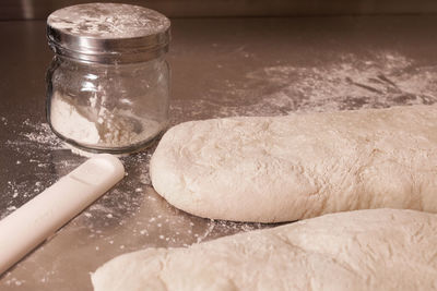 Close-up of dough and flour on table