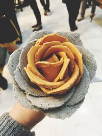Close-up of hand holding ice cream