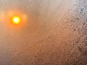 Full frame shot of wet glass window