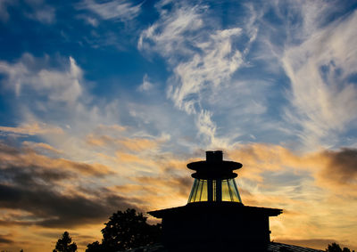 High section of silhouette built structure against scenic sky