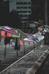 Umbrellas hanging in city during rainy season