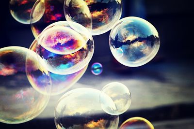 Close-up of bubbles against blue sky