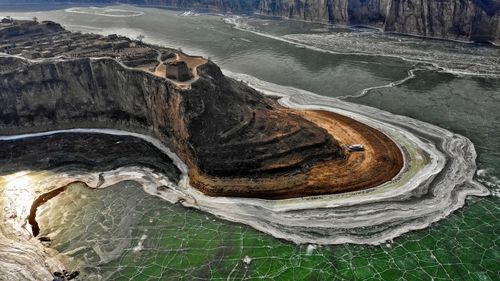 High angle view of rock formation in water