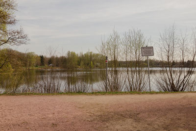 View of calm lake against sky