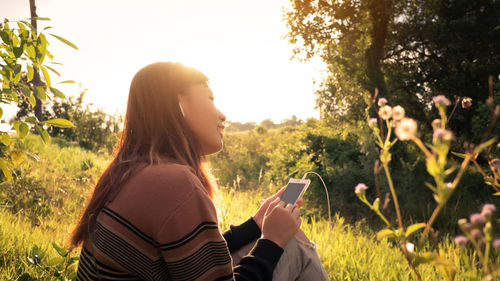 Young woman using mobile phone