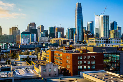 Modern buildings in city against sky