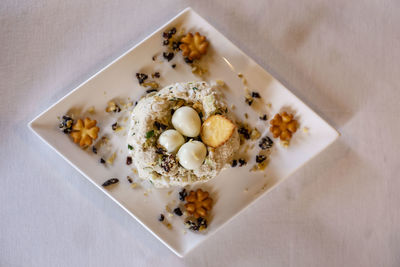 High angle view of eggs in plate on table