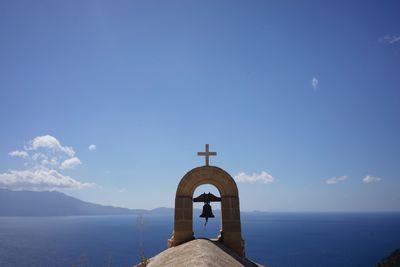 Bell over church against sky