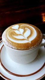 Close-up of cappuccino on table