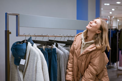 Smiling woman standing in store