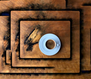 High angle view of coffee cup on table