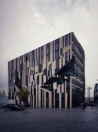 Modern buildings in city against sky