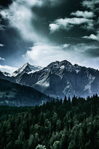 Scenic view of snowcapped mountains against sky