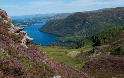 High angle view of sea and mountains against sky