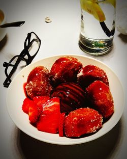 High angle view of strawberries in plate on table